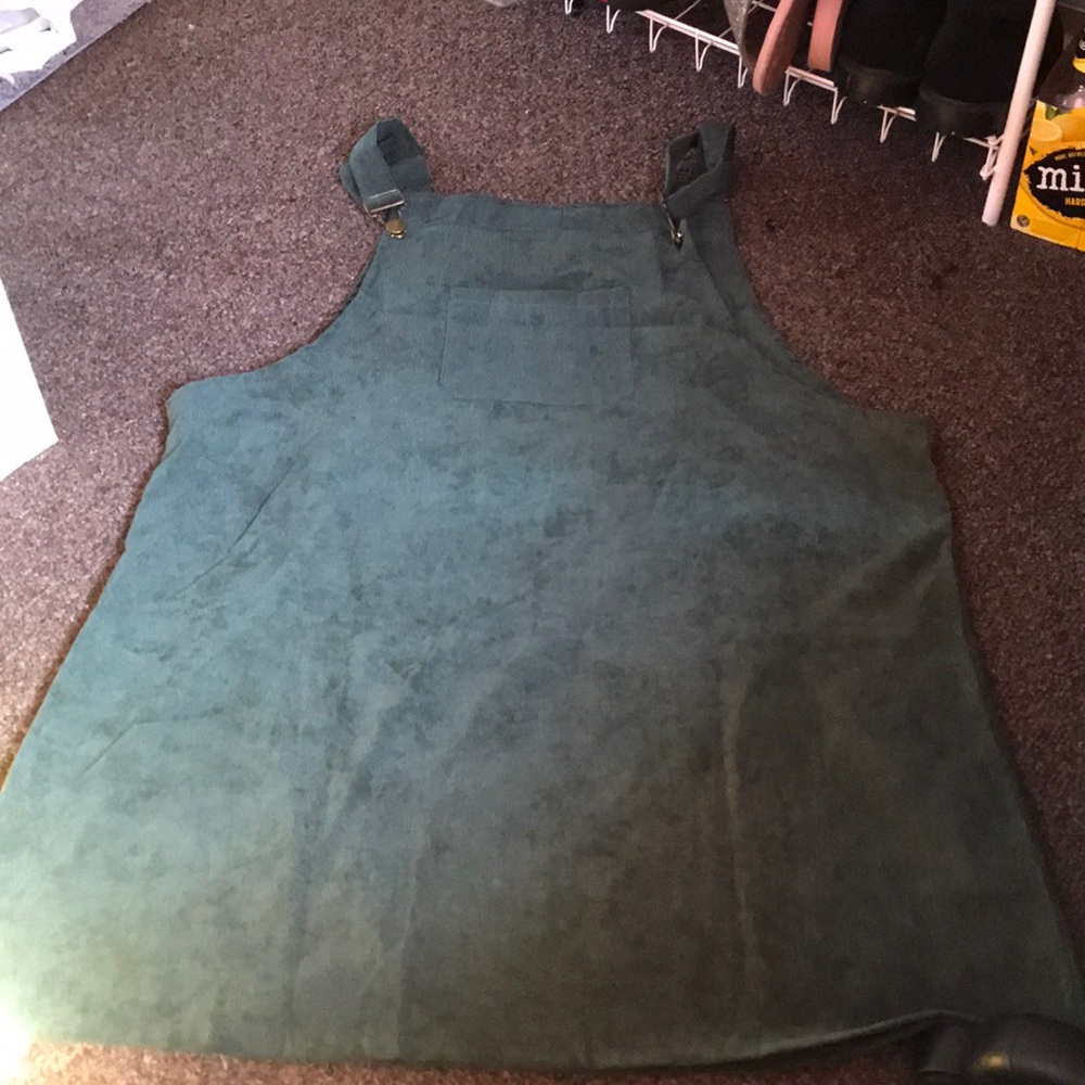 A green dress/overalls